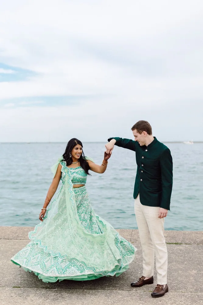 Nikhi and Kyle dancing by the water