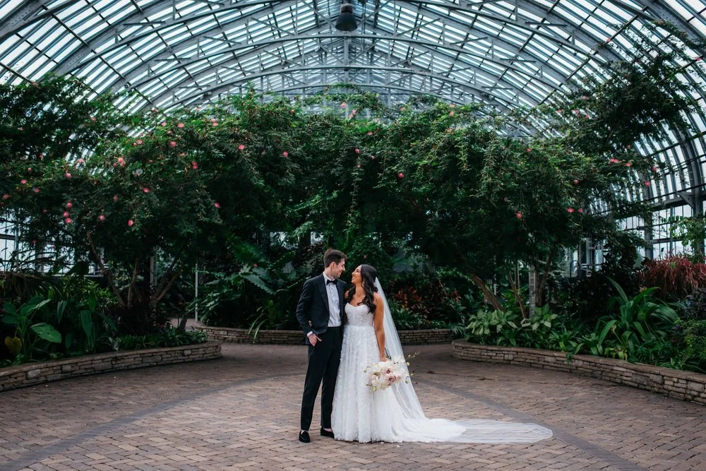 Sydney and Dylan in a glass-domed greenhouse
