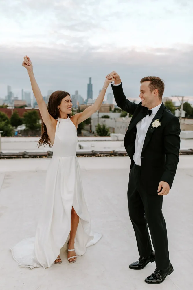 Jamie and Matt dancing on a rooftop